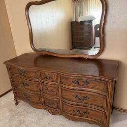 Bedroom Set. Mirrored Dresser, Tall Dresser And A  Headboard 