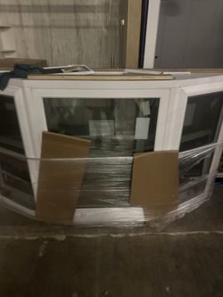 Small Windows, Large Windows, Sliding Glass Doors With Frames And One Big Bay Window