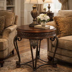 Beautiful traditional round end table with rich dark cherry finish and ornate carved detailing.