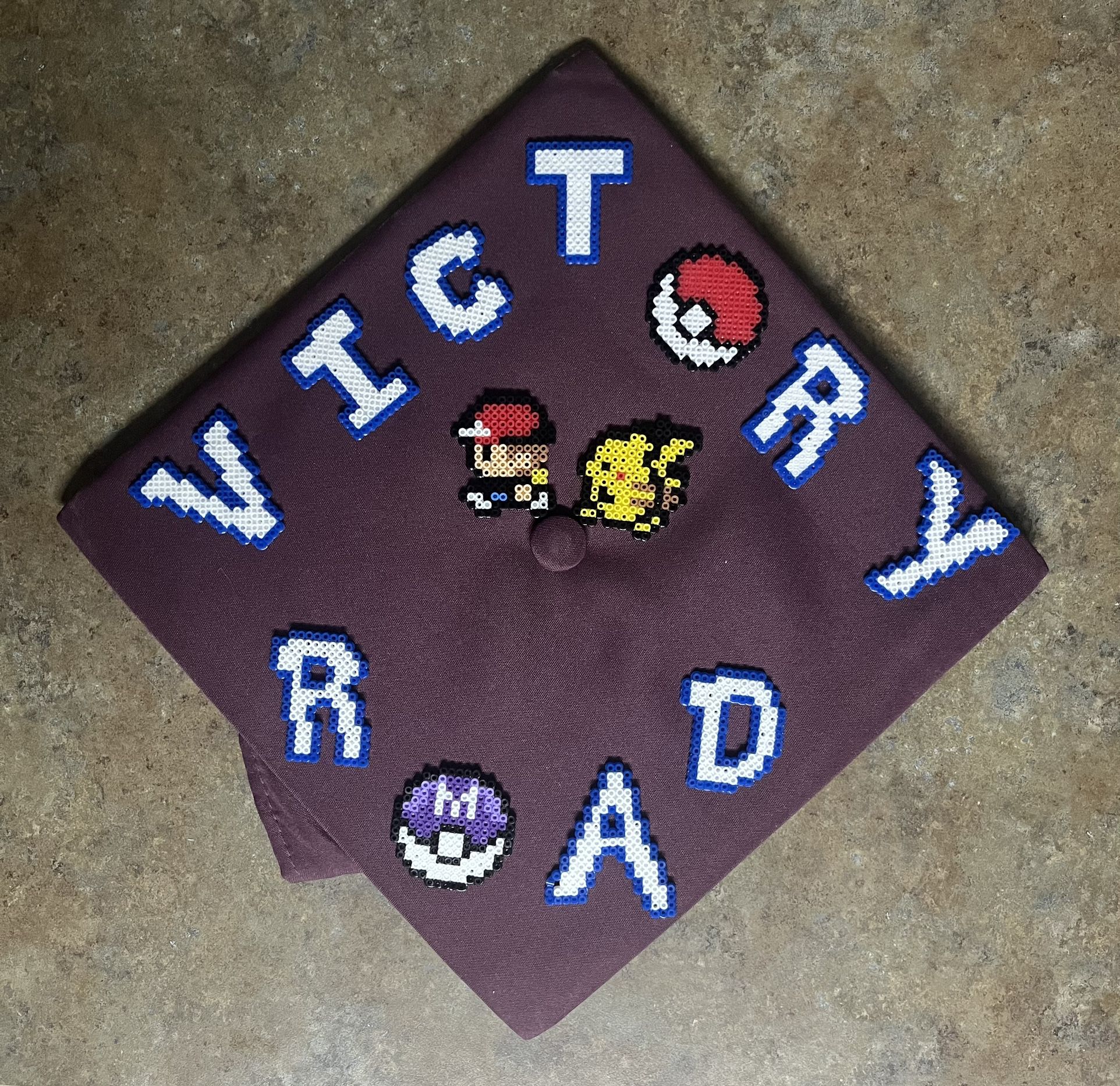 Victory Road Pokémon Graduation Cap Topper 