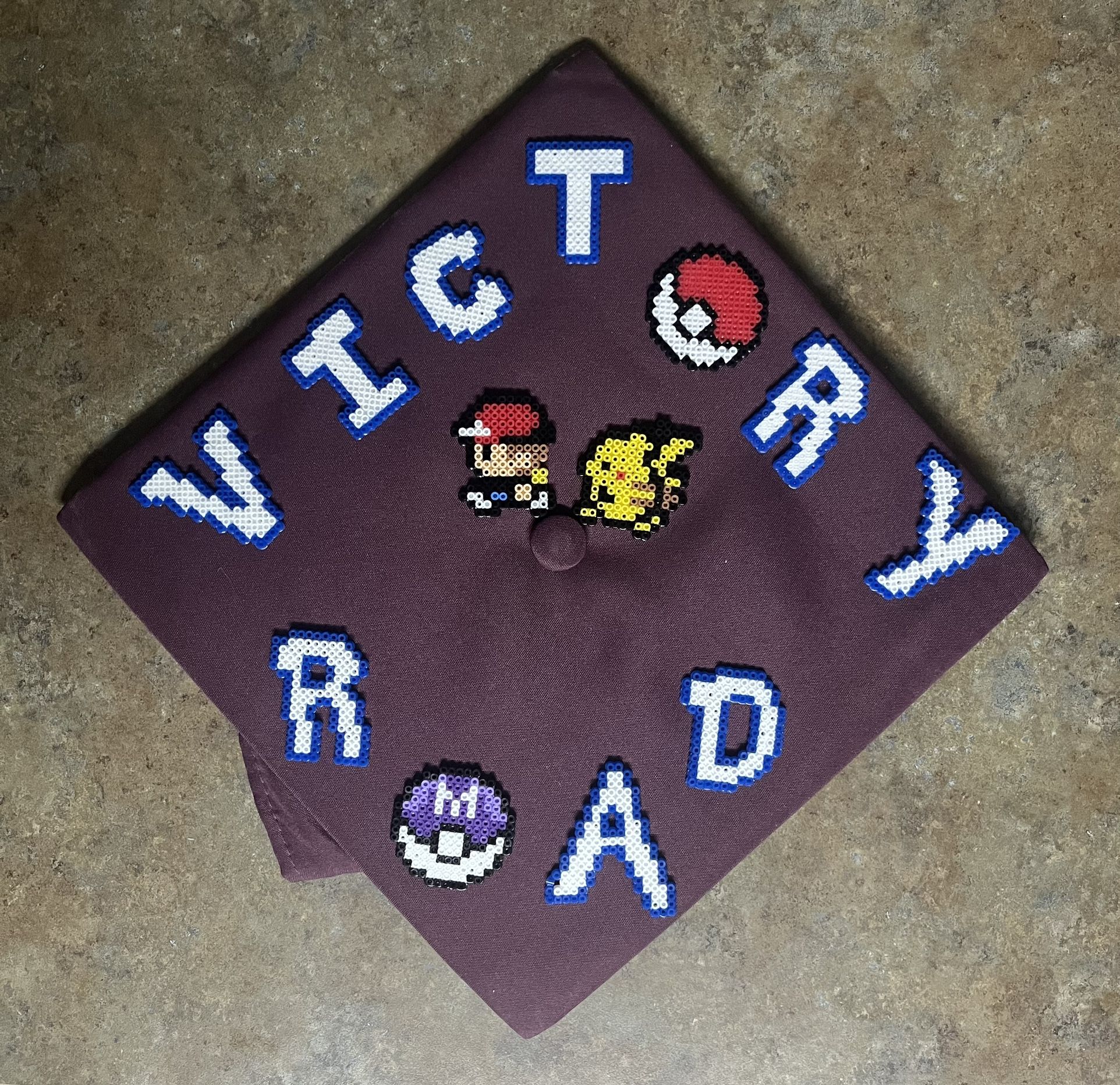 Victory Road Pokémon Graduation Cap Topper