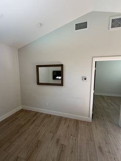 Wall Mirror – Wood Frame, Ready to Hang (Woodland Hills)  Description: Selling a wall mirror in great condition.  * Solid wood frame * Clean, modern l