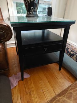 2 end tables with glass tops