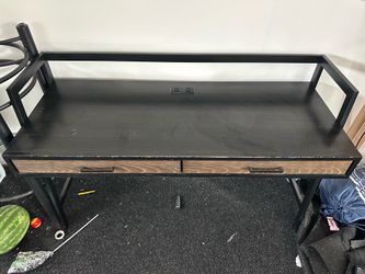 Sturdy office desk with drawers and power outlets