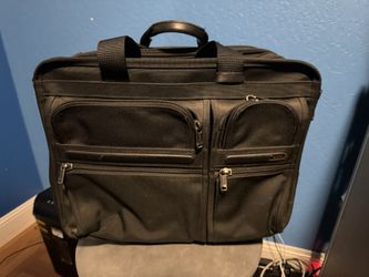 Tumi - laptop bag/roller