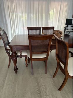 Wood Dinning table and 6 chairs. Table extends to 12 servings