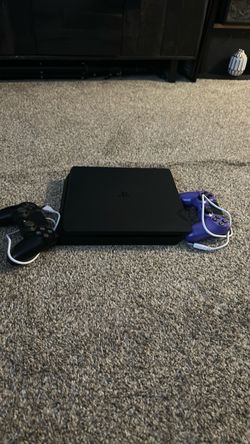PlayStation 4 Slim Console with Two Controllers
