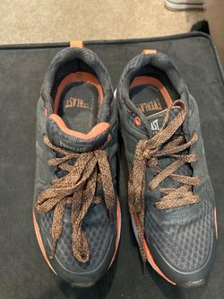 Grey and orange Everlast tennis shoes.