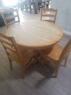 wood table with four chairs