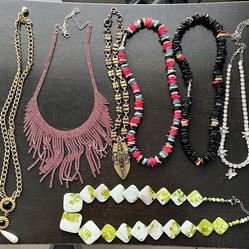 collection of assorted fashion necklaces,