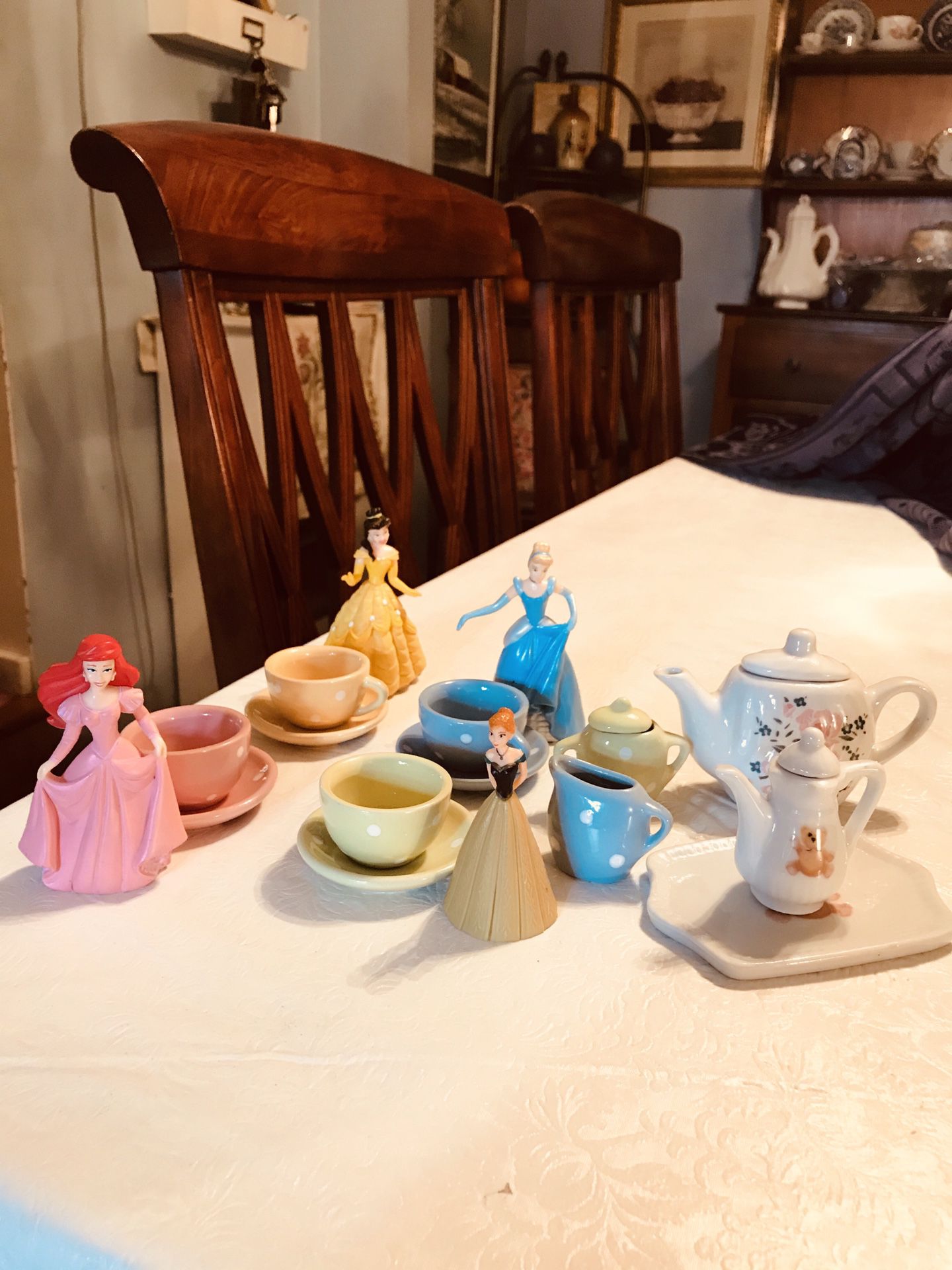 Cute little Tea Set, the original teapot is missing, so I compensated by adding Little Disney dolls and another teapot