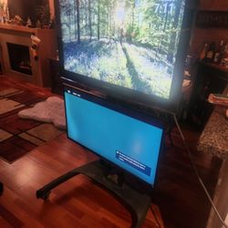 Dual Rolling TV Stand With 2 HD TVs. Sony And Samsung