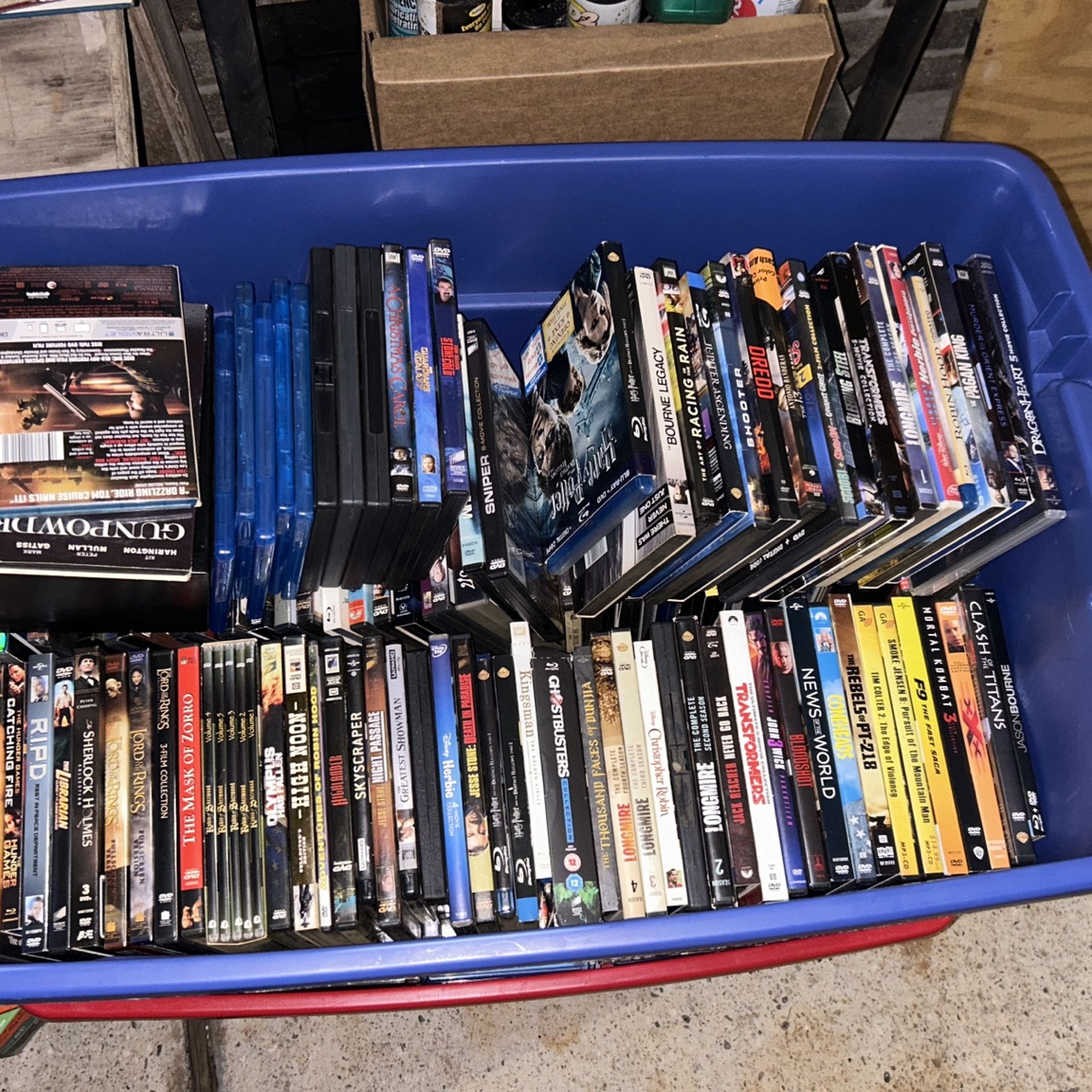 Two giant bins Of DVDs And blue rays