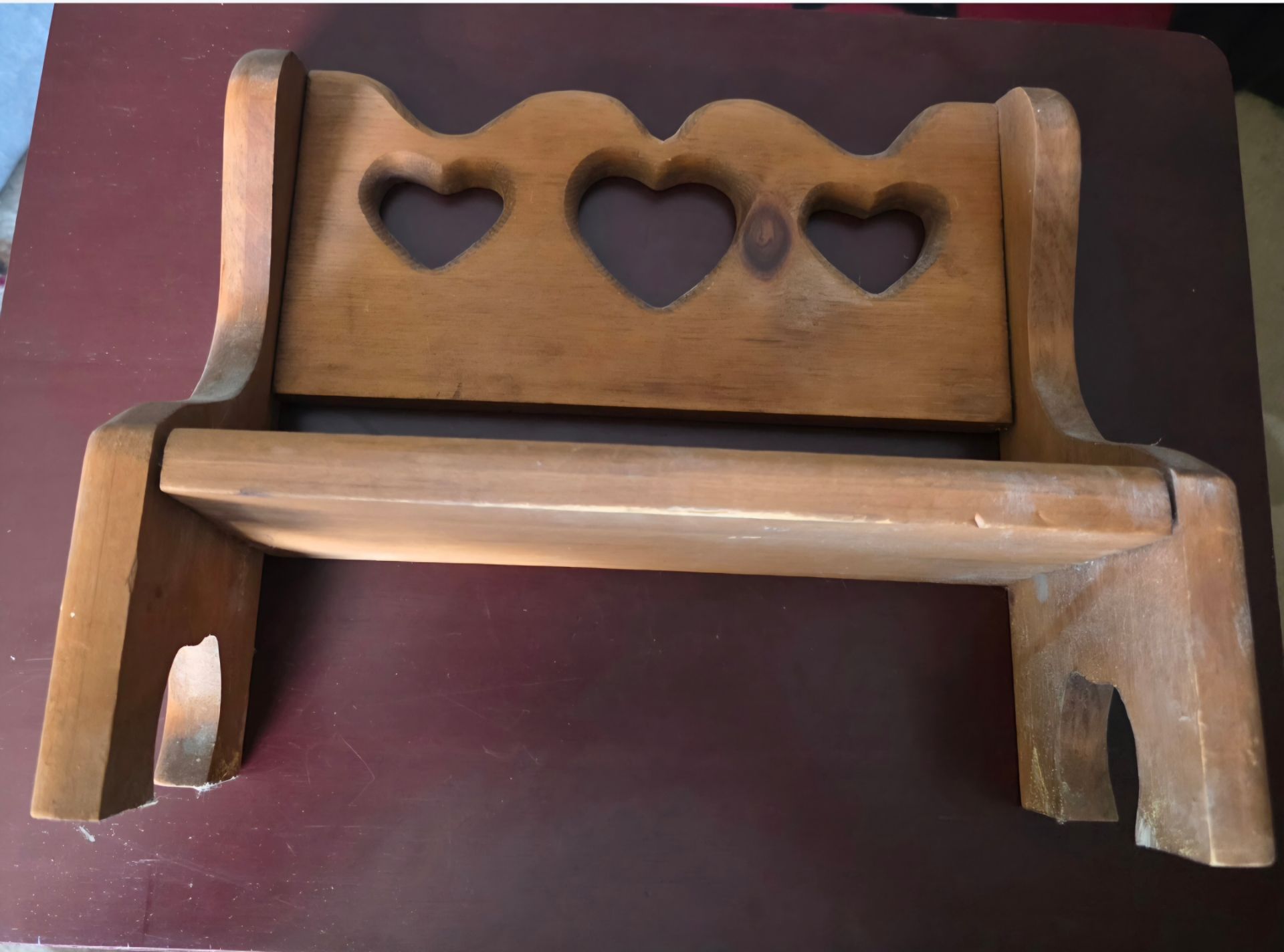 VINTAGE Grannycore cottagecore small wooden bench with heart cutouts.