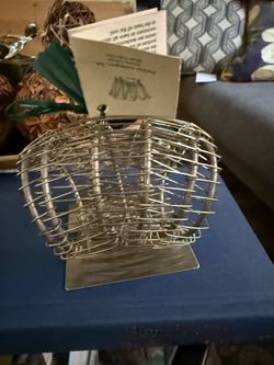 Perfect Arrangers Stainless Steel Floral Frog   Stainless steel floral cage from Perfect Arrangers. This silver-toned metal tool has a flexible wire c
