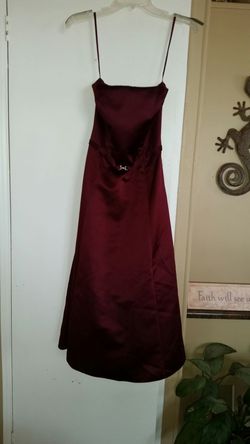2 identical burgundy strapless dresses