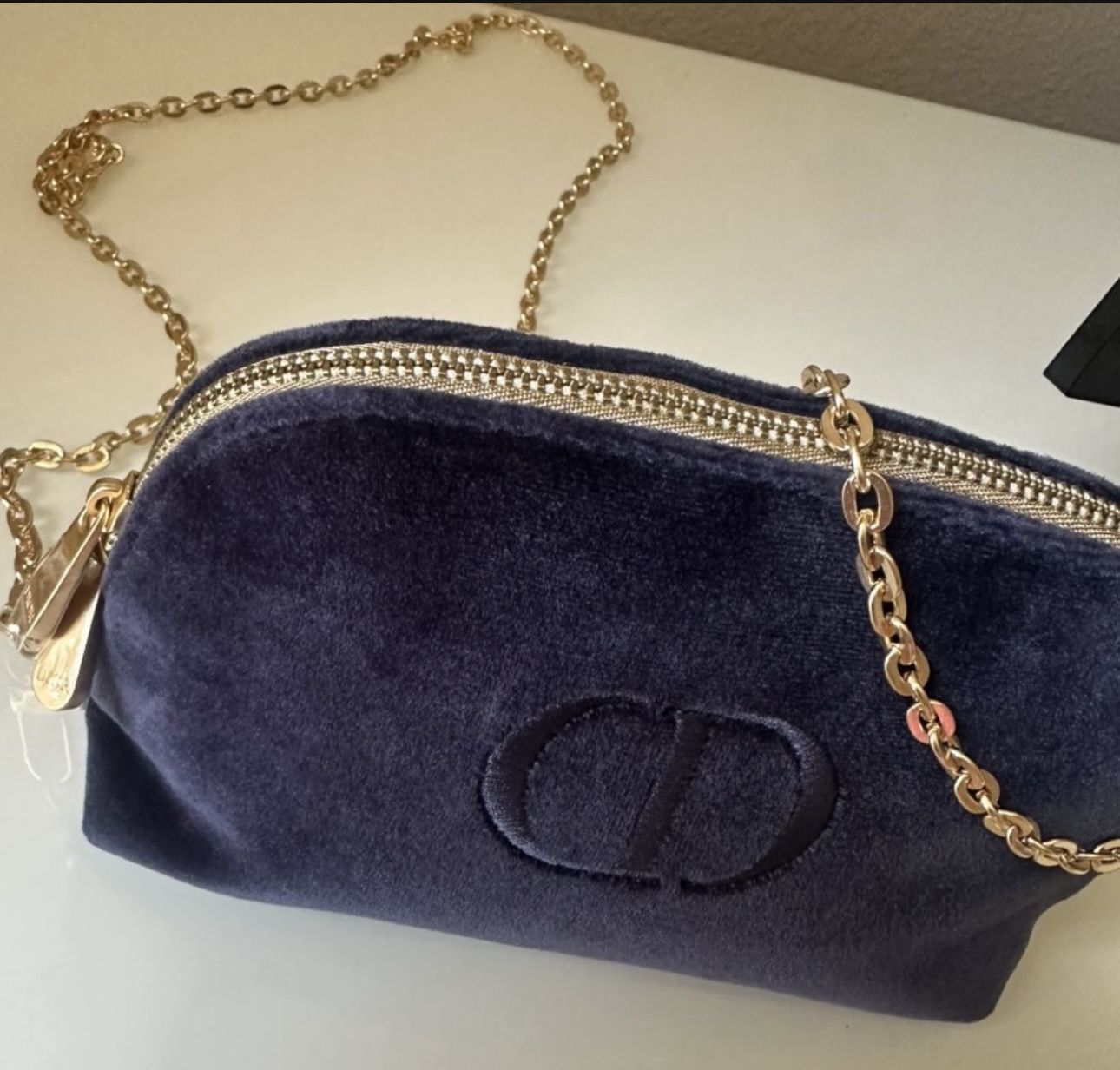 Dior Minaudière blue purse.