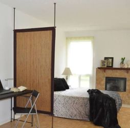 Bamboo Room Divider In Honey Color.