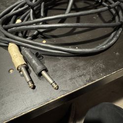 10ft electric guitar cable (used) works great.
