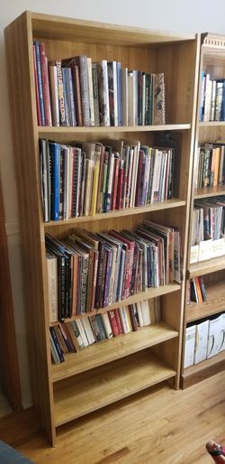 Two wood veneer bookcases