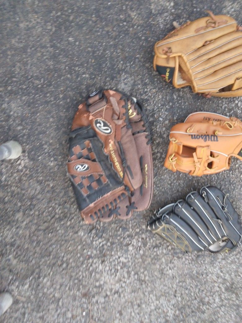 FIVE.       BASEBALL GLOVES.  DIFFERENT  SIZES