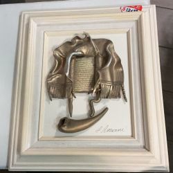  3D bronze relief artwork depicting a Sefer Torah and Shofar by artist L. Amrani