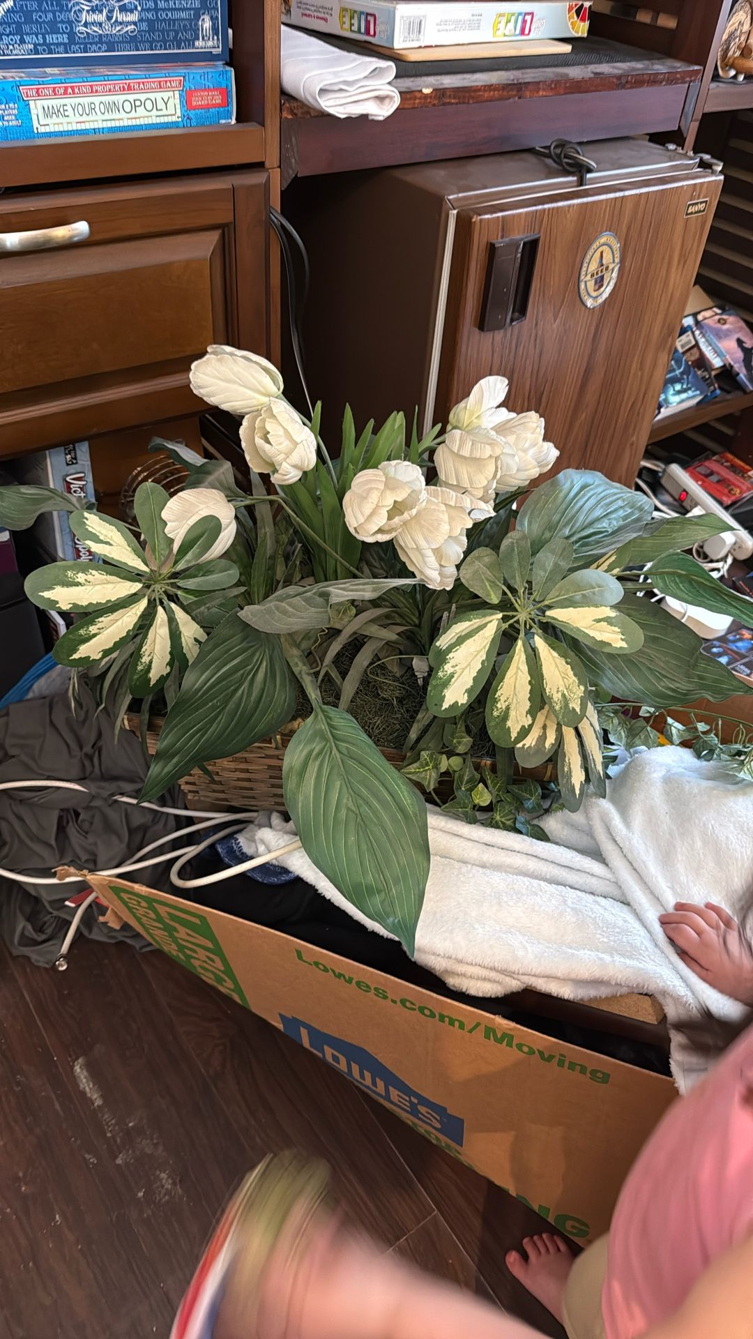 Big fake plant decoration in wicker basket always just been sitting on the shelf