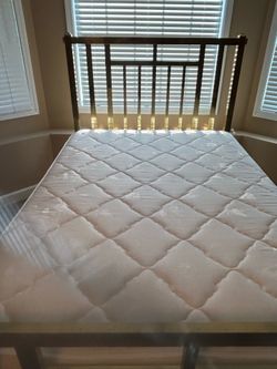 Brass bed with mattresses