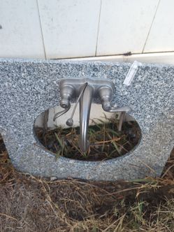 Faucet still works. Marble looks pretty good too