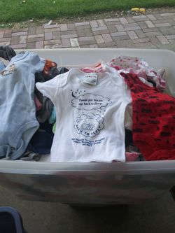 Tube of baby clothes under shirts little pants socks 1.00 each need gone