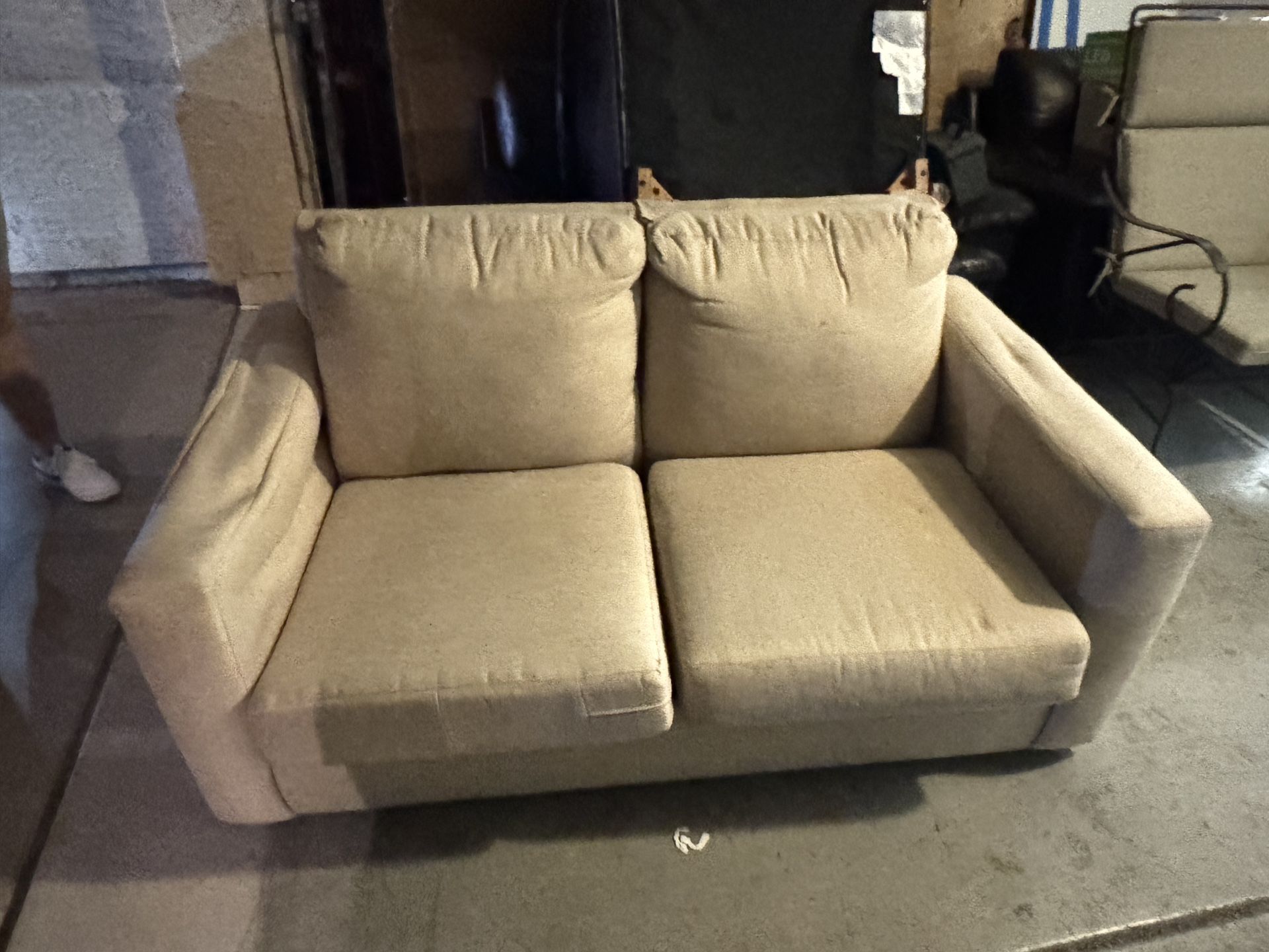 Beige loveseat couch with pull out bed