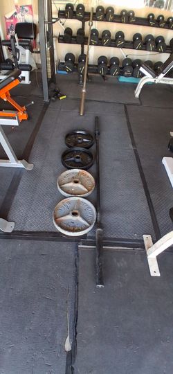 7' Olympic bar  4 - 35s Olympic plates. $160