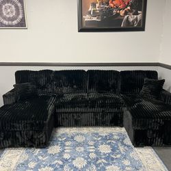 Black double chaise pull- out sleeper w/ storage