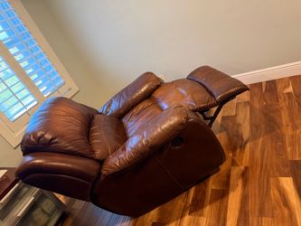Brown Leather Rocking Swivel Chair – $180 Negotiable