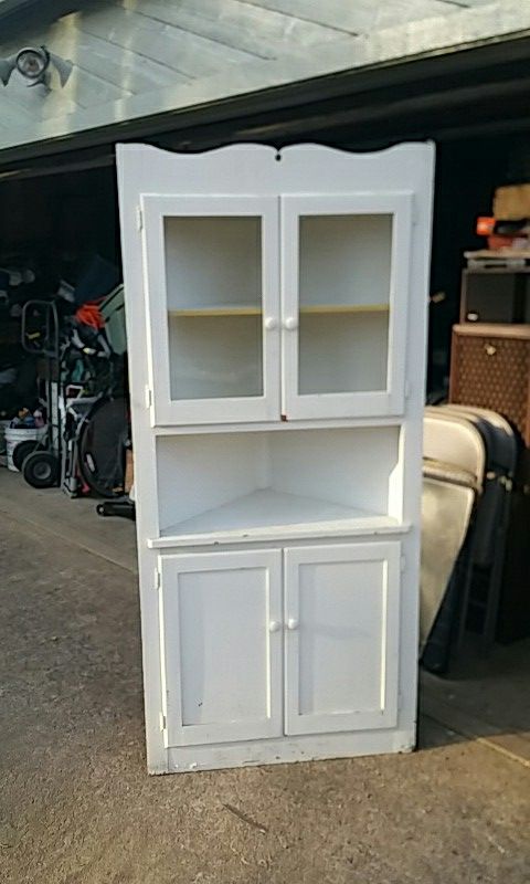 Antique corner china cabinet white in color