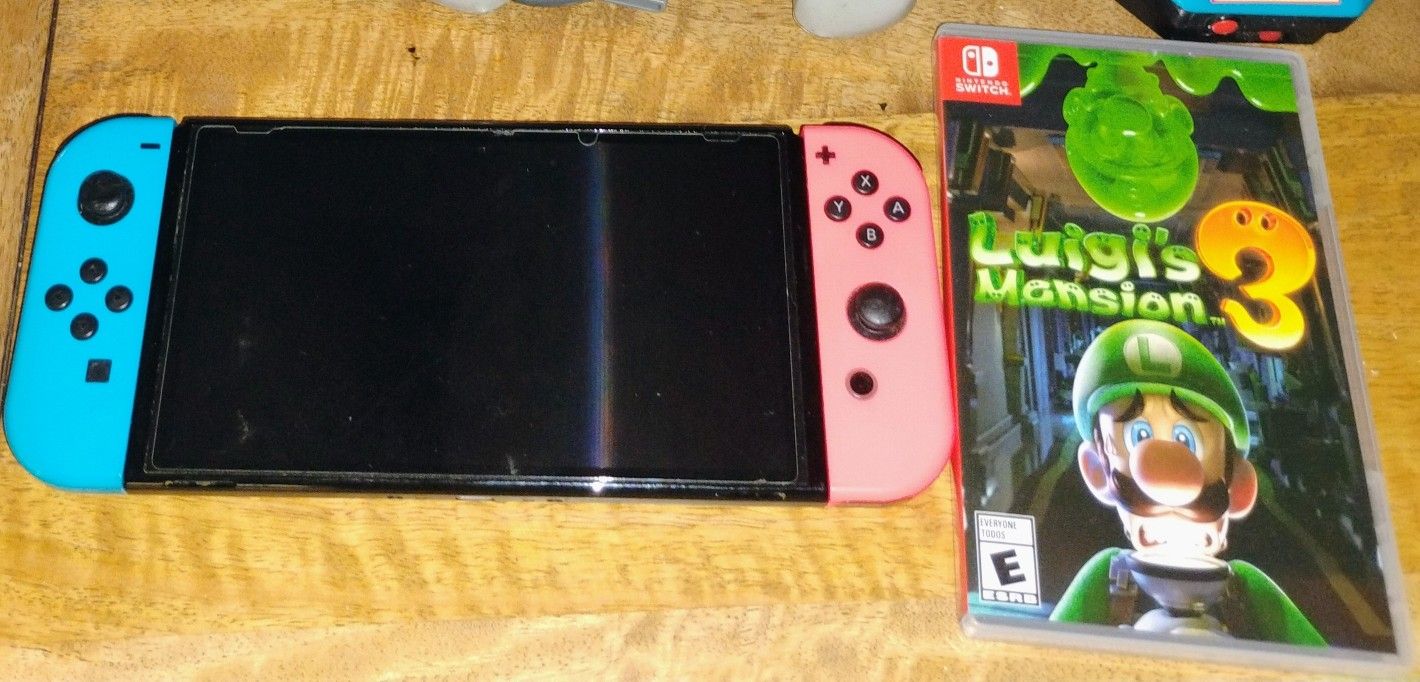 Nintendo Switch OLED, Luigi's Mansion, and Pro Controller With Back Buttons