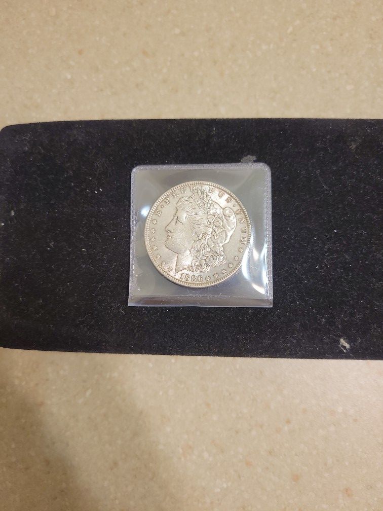 1886 Morgan Silver Dollar. AU/Bu Condition 