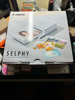 Canon CP-1500 photo printer and extra photo paper.
