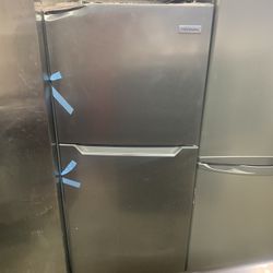 frigidaire  new 24 inches top freezer has a  small dent door