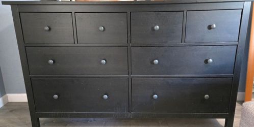 Black dresser and two matching bedside tables