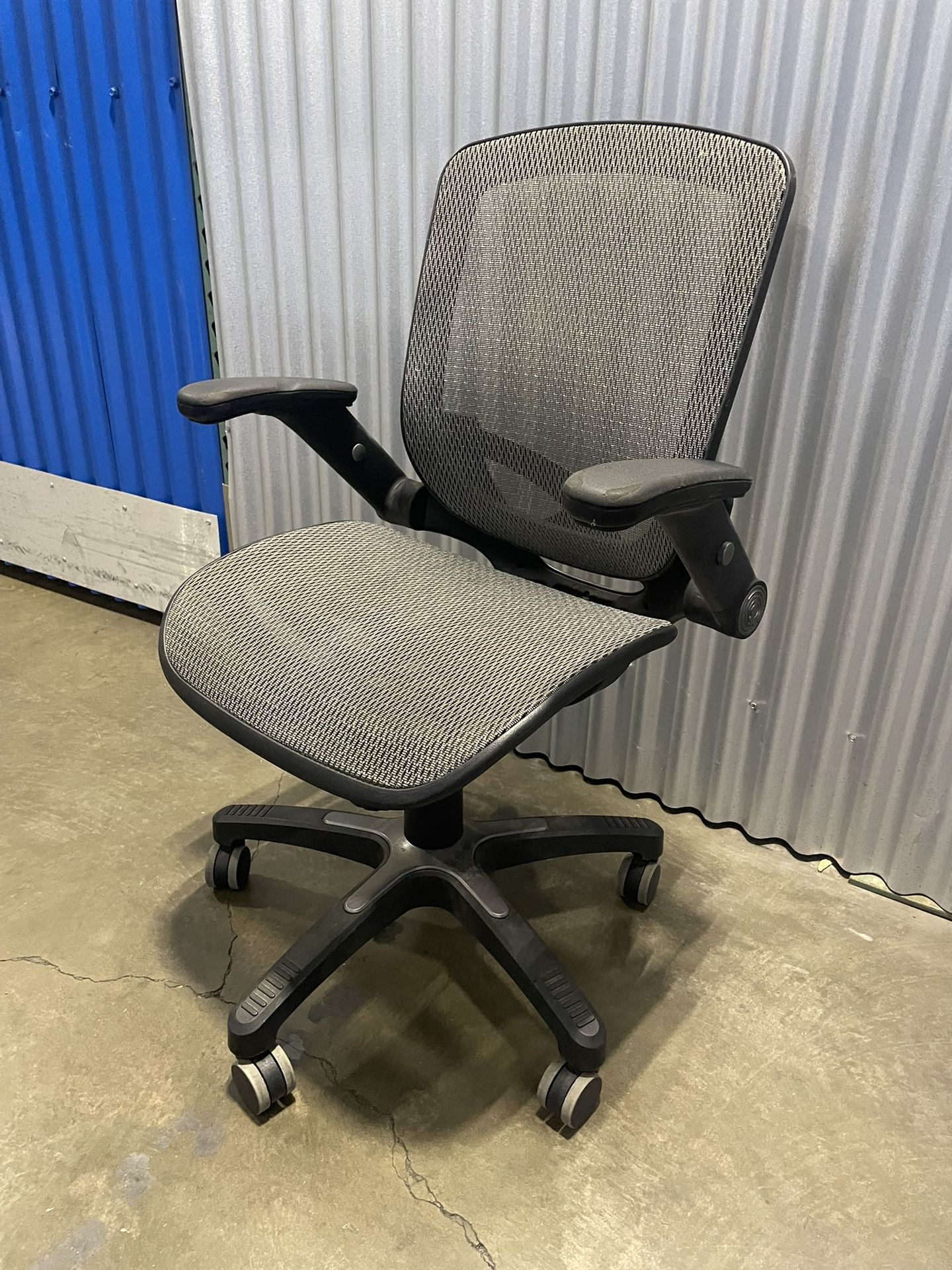 **ESTATE SALE**. Mesh Office Chair Swivels And Raises And Arms Move. 