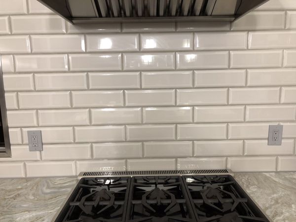 gray beveled subway tile backsplash