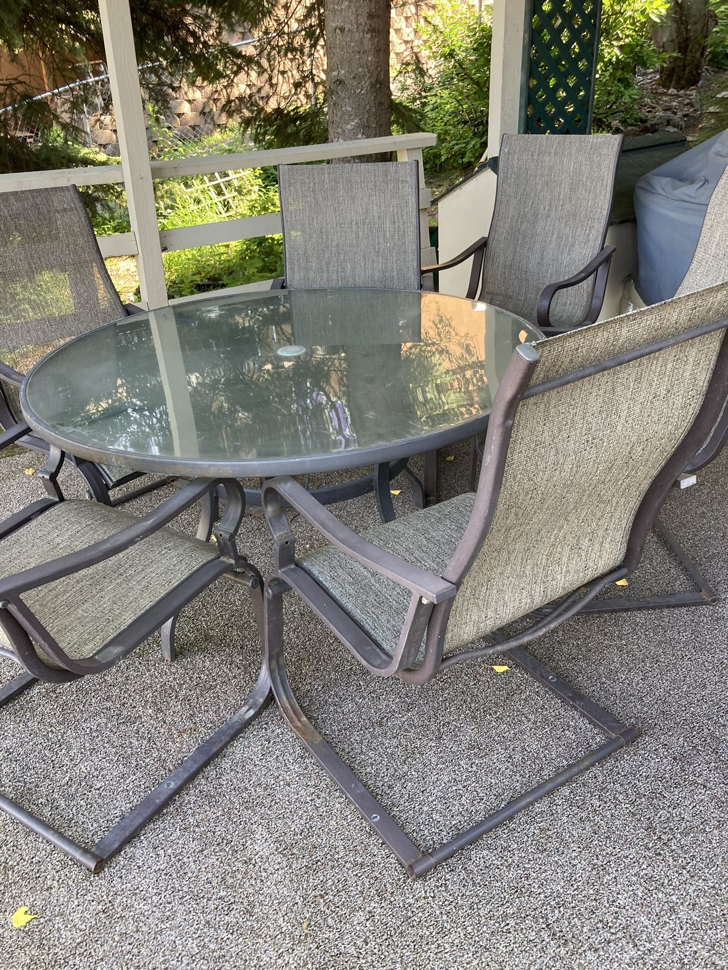 Outdoor Glass Top 60” Rnd Table & 6 Delux Chairs