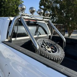 Chrome roll bar with 4 lights. $130 Fits full size truck  Spare tire Mount. $100. take both only $200.