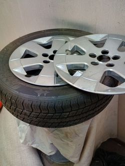 Toyota Prius lightly used tire and 2 wheelcovers