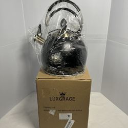 Luxgrace 2.6QT whistling tea kettle is a stovetop appliance designed to boil water efficiently.