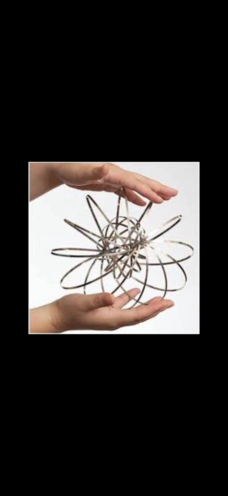 Experience the mesmerizing motion of the Metal Flow Ring Toy, a captivating kinetic sculpture perfect for stress relief, sensory play, or interactive