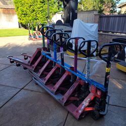 Lot of 13 Manual Pallet Jacks – Raymond