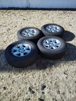 rims and tires for a Jeep size 17 two worn tires and two good ones