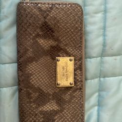 Michael Kors zip around wallet one has pink and silver other is kinda like a snake skin design prices for one